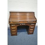 A 20TH CENTURY OAK ROLL TOP DESK, with fitted interior, eight various drawers, width 122cm x depth