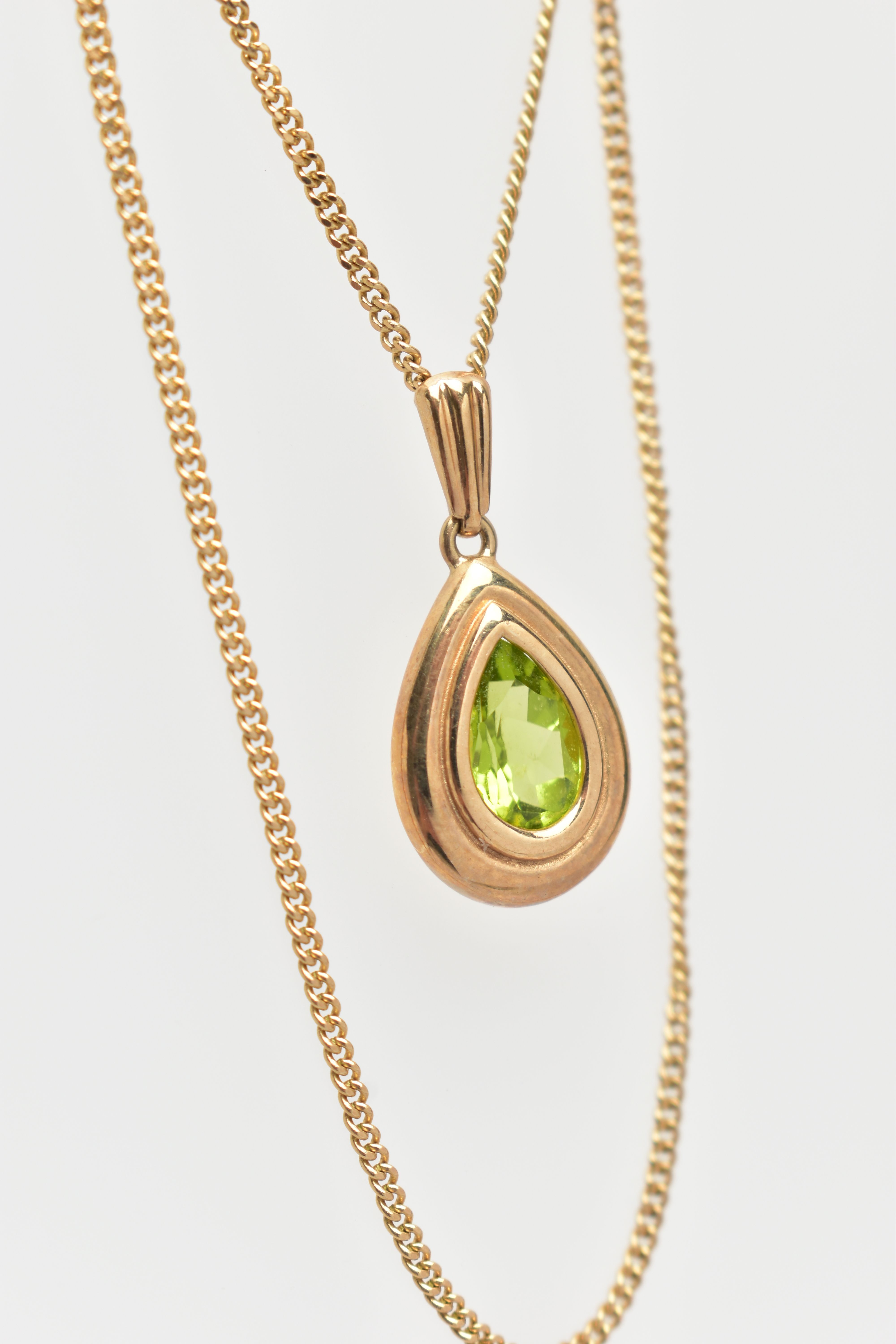 A 9CT GOLD PERIDOT PENDANT NECKLACE, the pendant of a pear drop shape, collet and claw set pear - Image 2 of 3