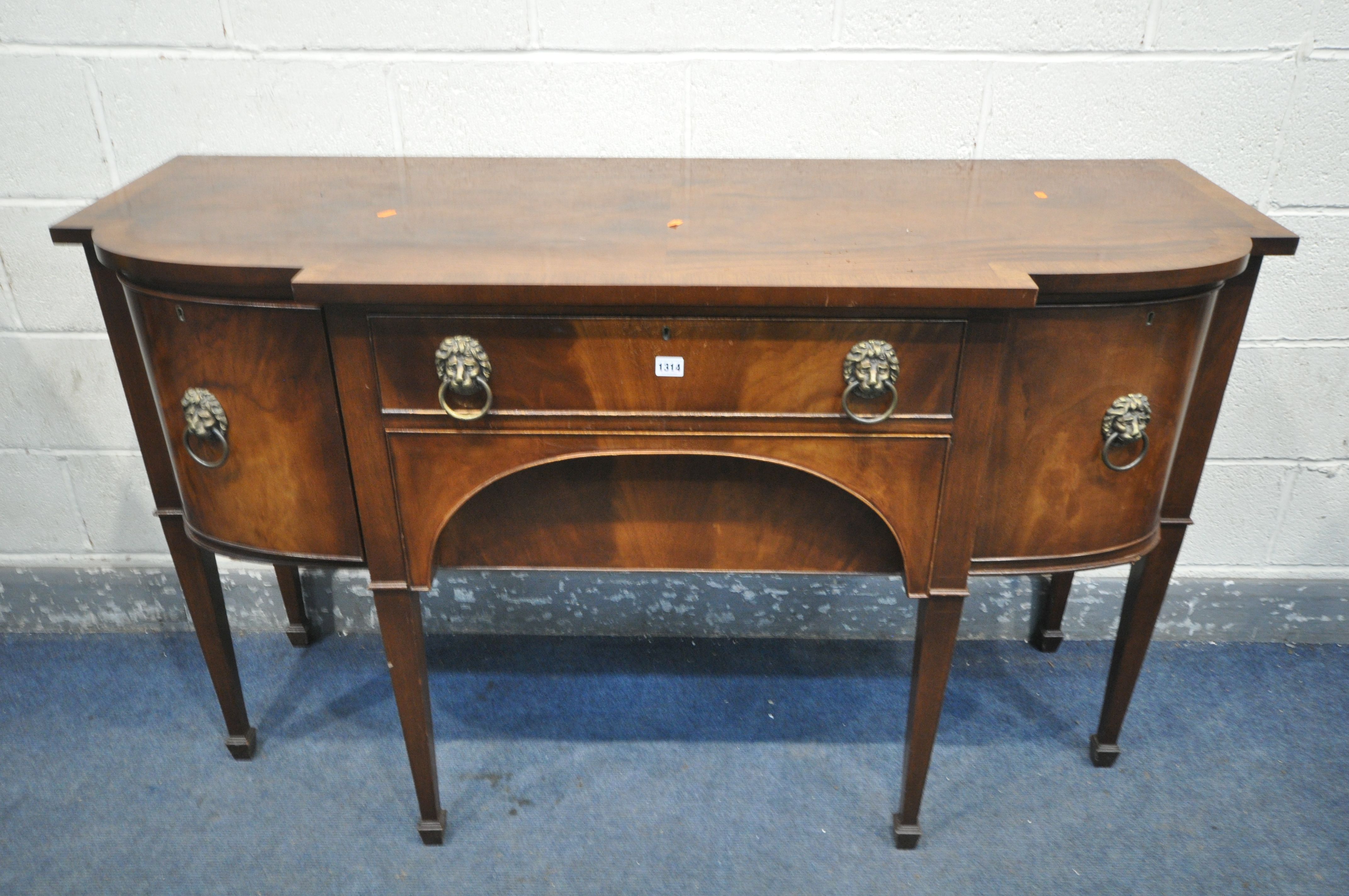 A GEORGIAN STYLE MAHOGANY SIDEBOARD, with double cupboard doors that's flanking two drawers, on