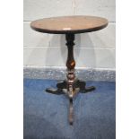 A CIRCULAR TRIPOD TABLE, made up of multiple antique timbers, diameter 46cm x height 70cm (