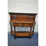 A 20TH CENTURY CANTED OAK SIDE TABLE, with a raised panelled back, a single frieze drawer, on turned