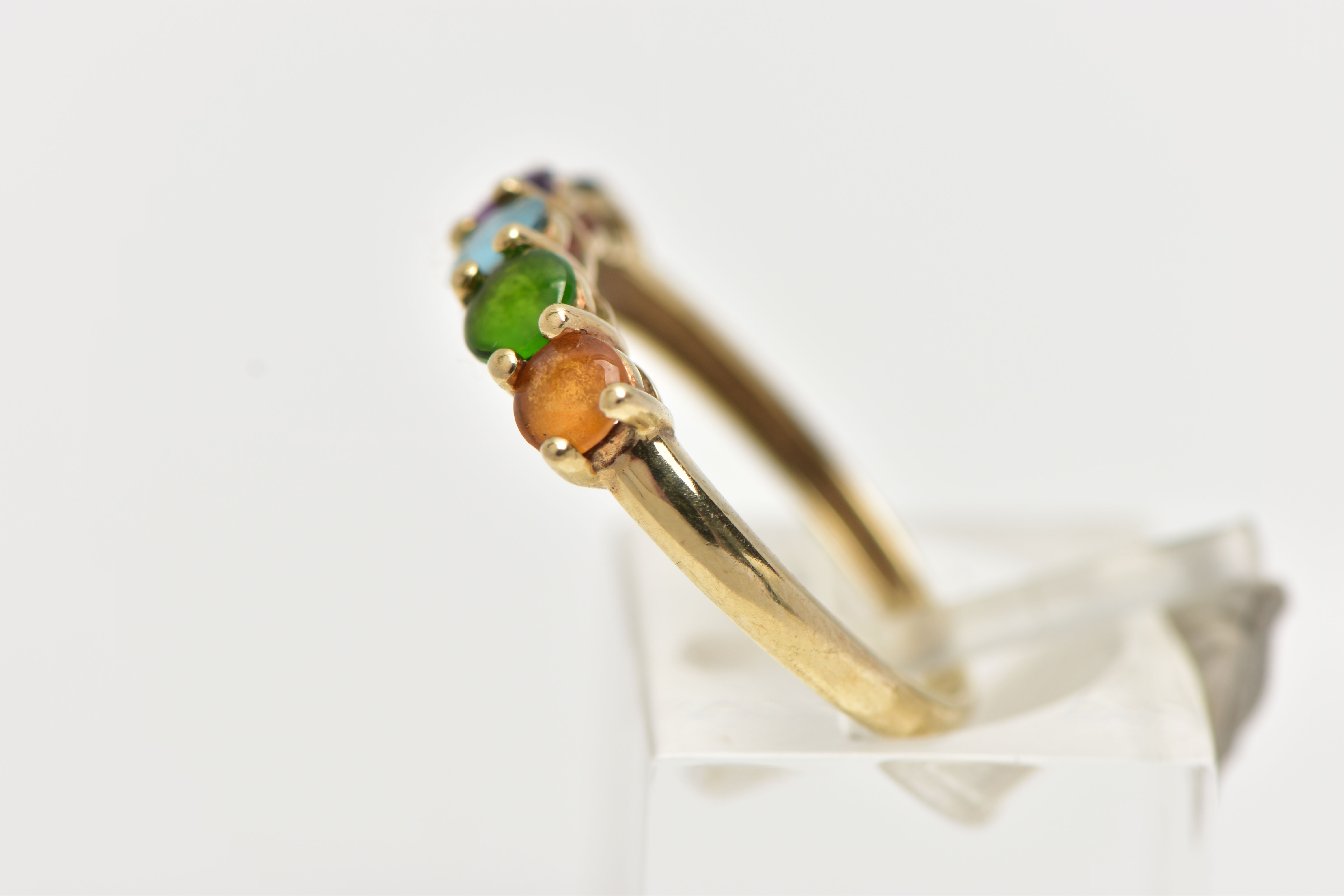 A 9CT GOLD FIVE STONE RING, designed with a row of five claw set, circular cut cabochon stones to - Image 2 of 4