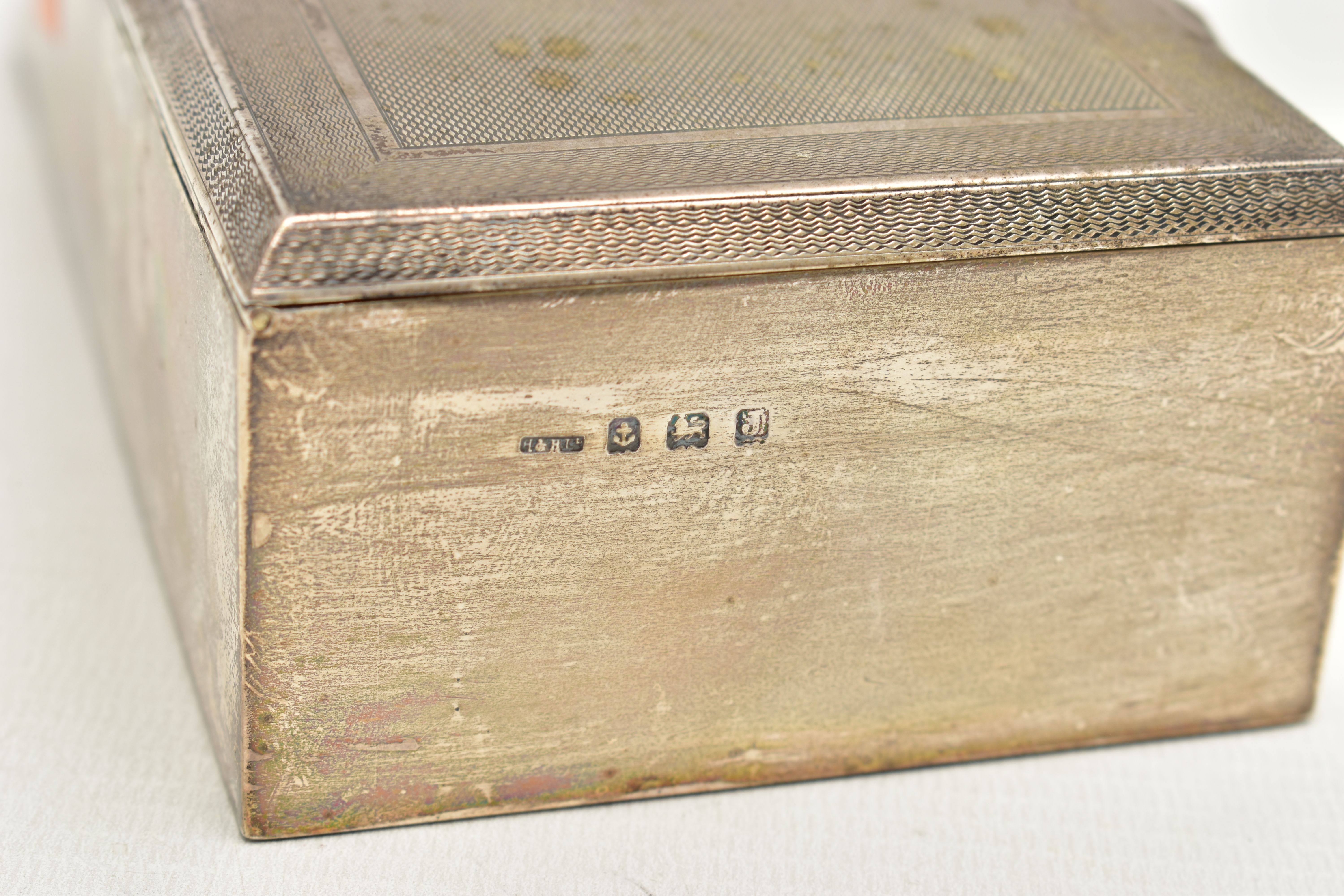 A SILVER CIGARETTE BOX, of a rectangular form, engine turned pattern with an engraved cartouche to - Image 4 of 4