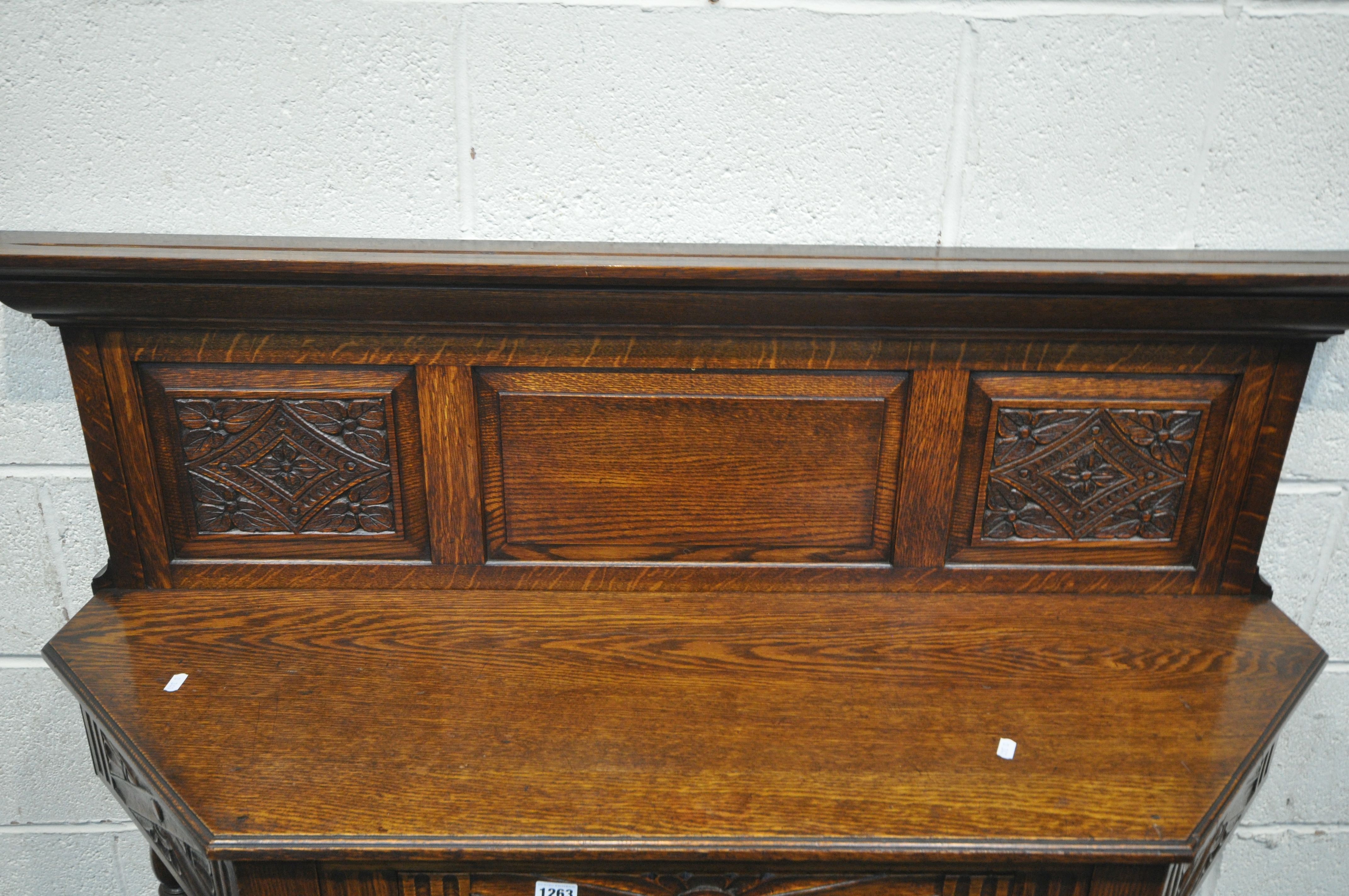A 20TH CENTURY CANTED OAK SIDE TABLE, with a raised panelled back, a single frieze drawer, on turned - Image 3 of 4