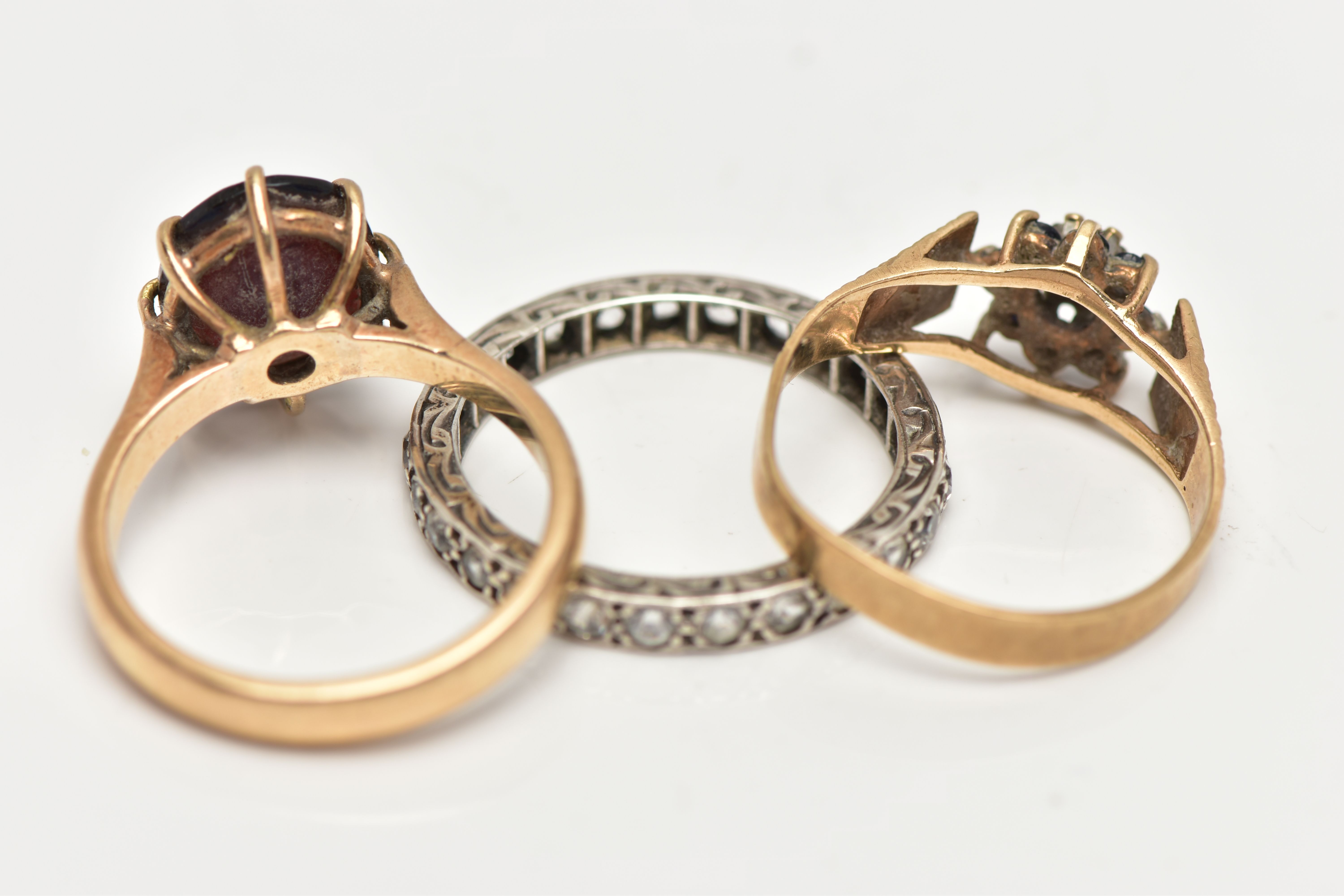 THREE GEM SET RINGS, the first designed with an oval cut garnet in an eight claw setting with - Image 4 of 4
