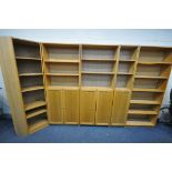 A SET OF FIVE IKEA OAK EFFECT OPEN BOOKCASES, including a corner section, three with cupboard doors,