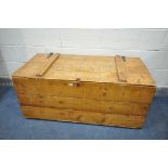 A LARGE PINE STORAGE CHEST, appears to be adapted from various crates, later hinges and handles,