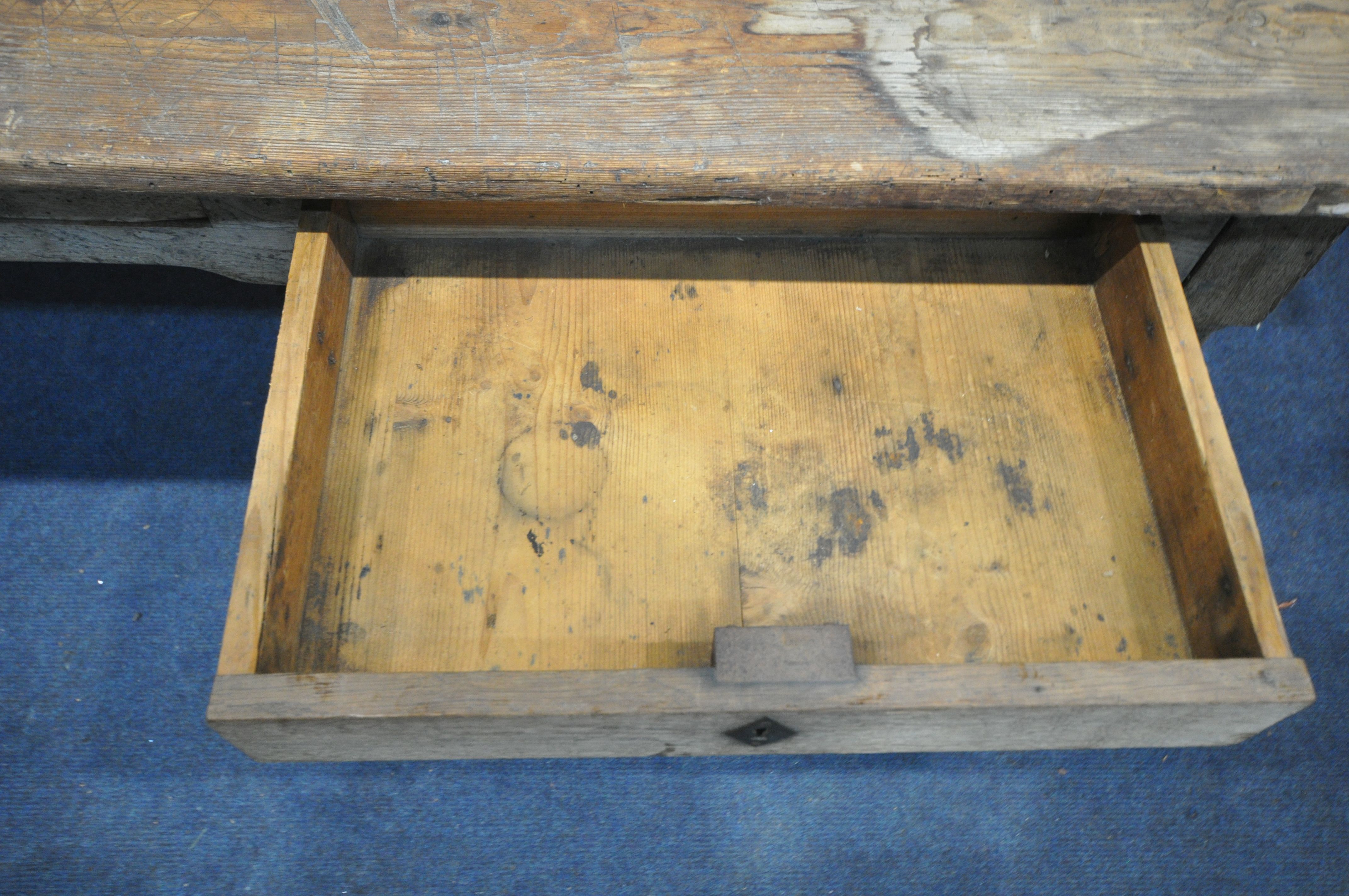 A 19TH CENTURY FARMHOUSE TABLE, the pine top with penny slots, three frieze drawers, on an oak base, - Image 5 of 6