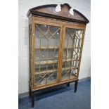 AN EDWARDIAN MAHOGANY AND MARQUETRY INLAID ASTRAGAL GLAZED TWO DOOR BOOKCASE, with a swan neck
