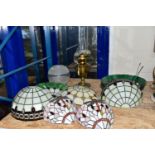 A GROUP OF GLASS LIGHTSHADES, LIGHT FITTINGS AND AN OIL LAMP, comprising three leaded glass