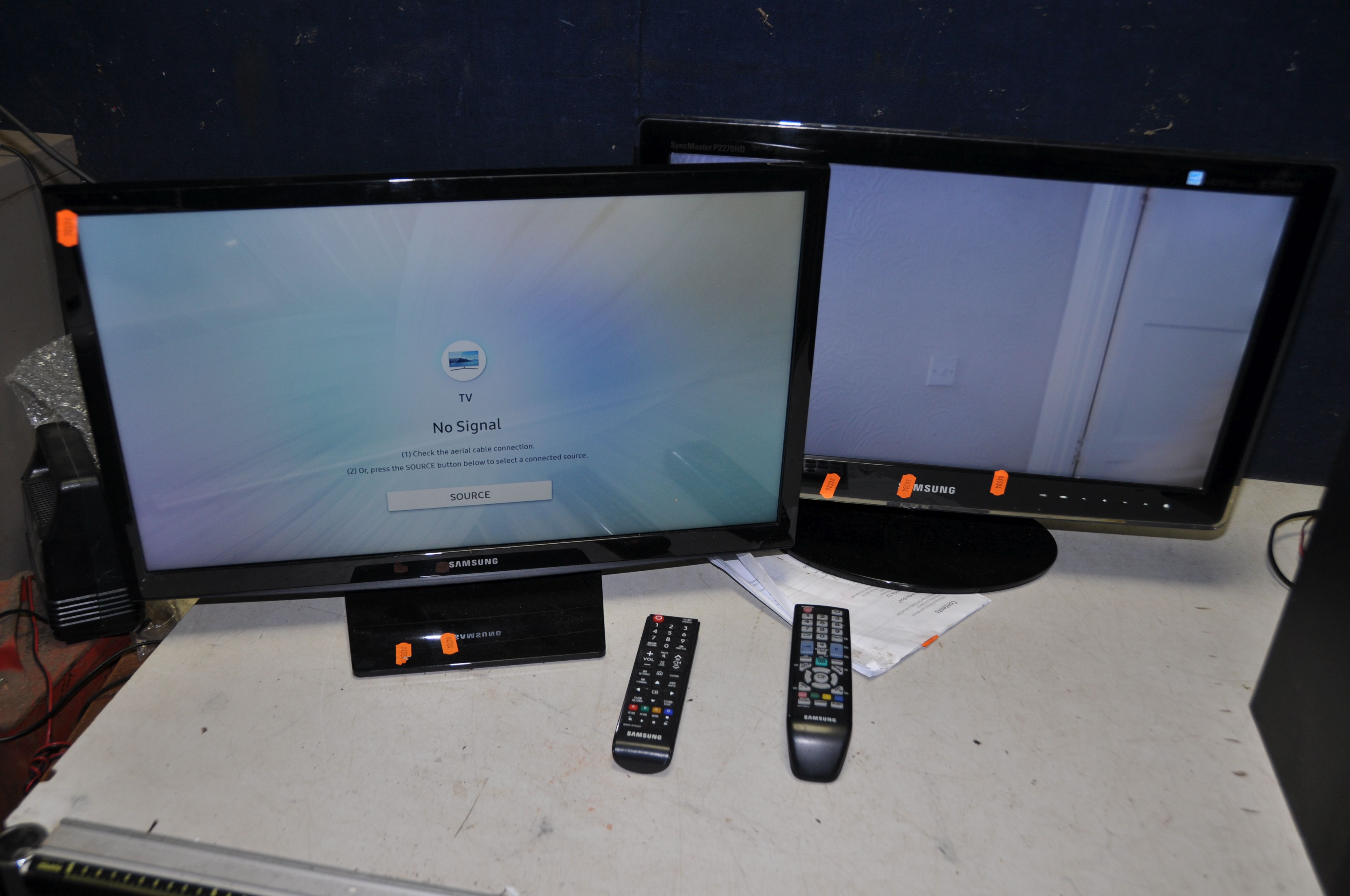 A SAMSUNG UE24N4300AK 24in TV with remote, and a Samsung P2270HD 22in TV with remote (both PAT