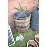 A PAIR OF OAK HALF BARREL PLANTERS 63cm in diameter with poly liners for both