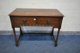 AN OAK SIDE TABLE, with two drawers, width 94cm x depth 46cm x height 74cm (condition:-water marks