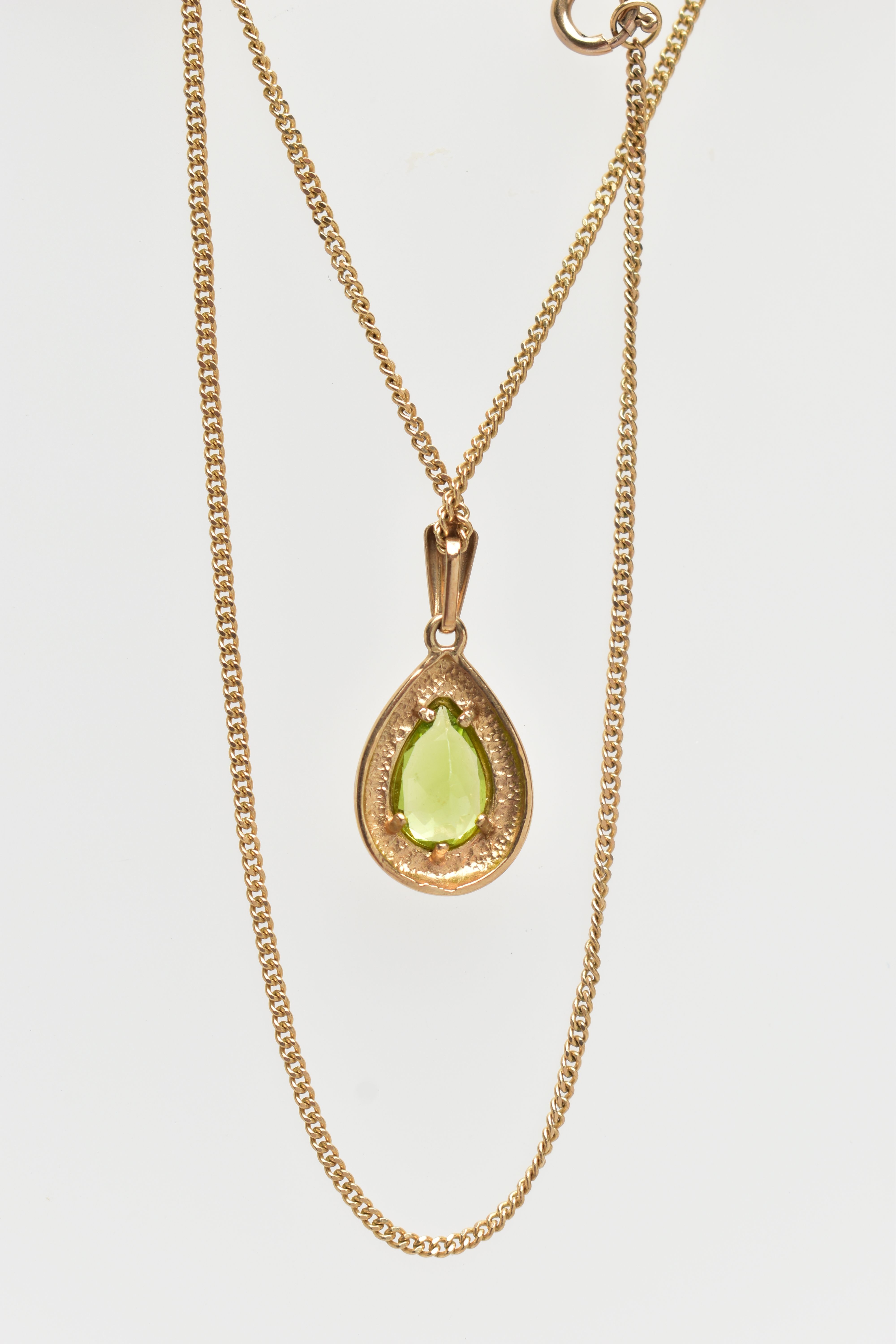 A 9CT GOLD PERIDOT PENDANT NECKLACE, the pendant of a pear drop shape, collet and claw set pear - Image 3 of 3