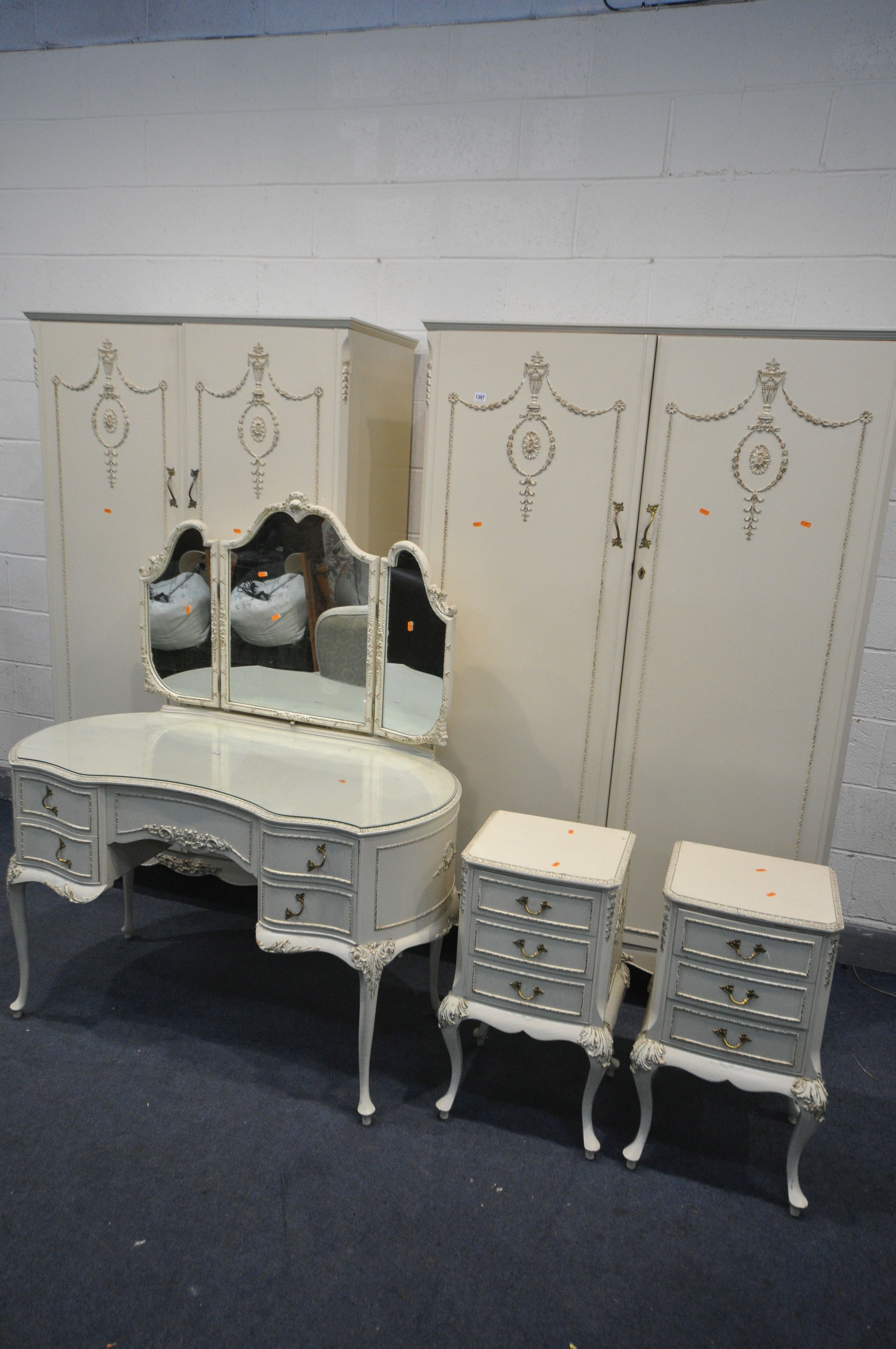 AN OLYMPUS FRENCH WHITE PAINTED FIVE PEICE BEDROOM SUITE, comprising two double door wardrobes,
