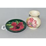 A MOORCROFT POTTERY VASE AND PIN DISH, the small vase in Magnolia pattern on a cream ground,