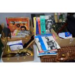 FOUR BOXES OF SUNDRIES AND ONE PICNIC BASKET, to include a black Breton cap, a large brass vintage