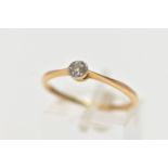 A YELLOW METAL SINGLE STONE DIAMOND RING, set with an old cut diamond in a milgrain setting,