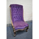 A VICTORIAN PURPLE UPHOLSTERED BUTTON BACK CHAIR, with a walnut frame, on front cabriole legs and