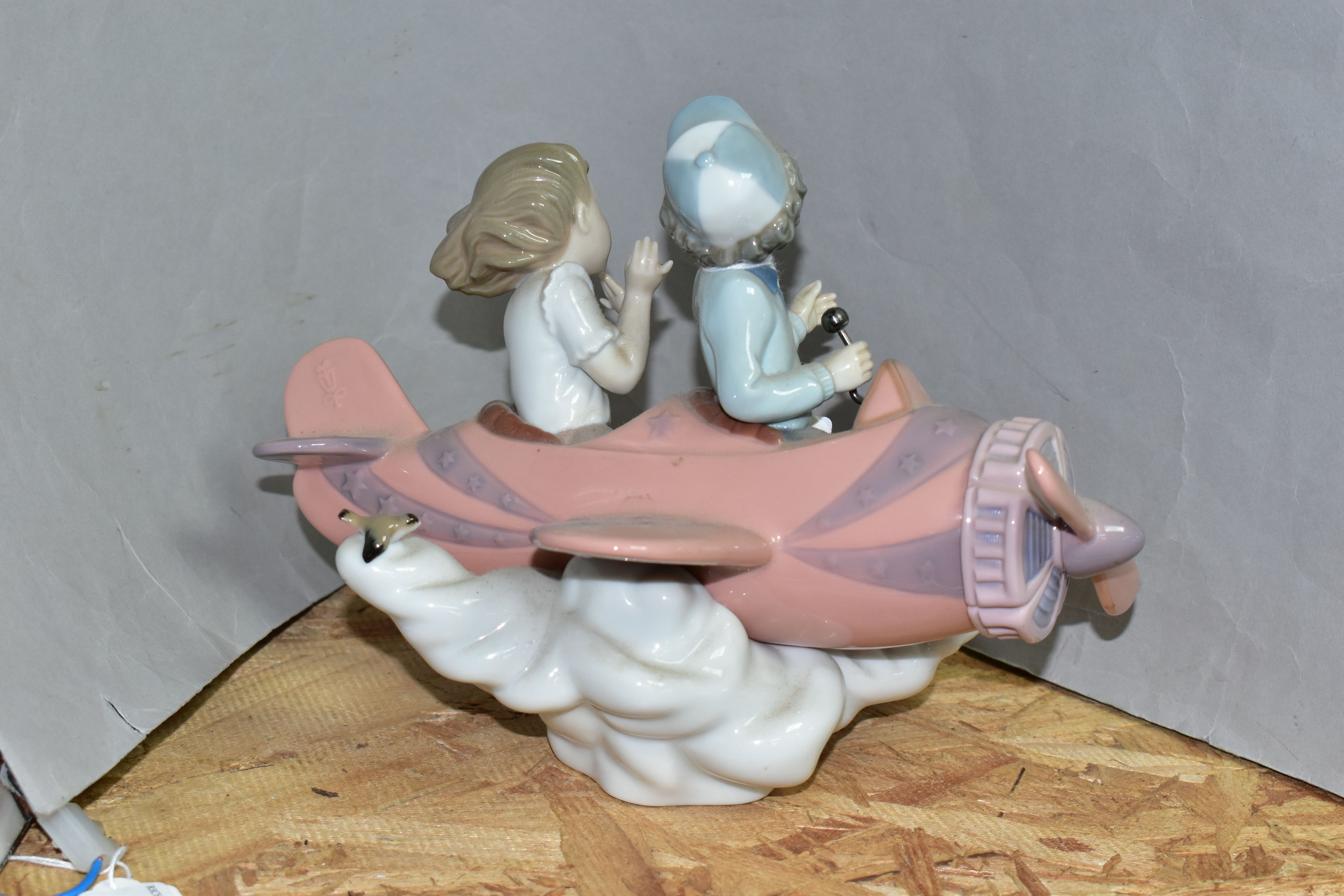 A LLADRO 'DON'T LOOK DOWN' SCULPTURE, model no 5698, depicting two figures in an aeroplane, sculptor - Image 2 of 5