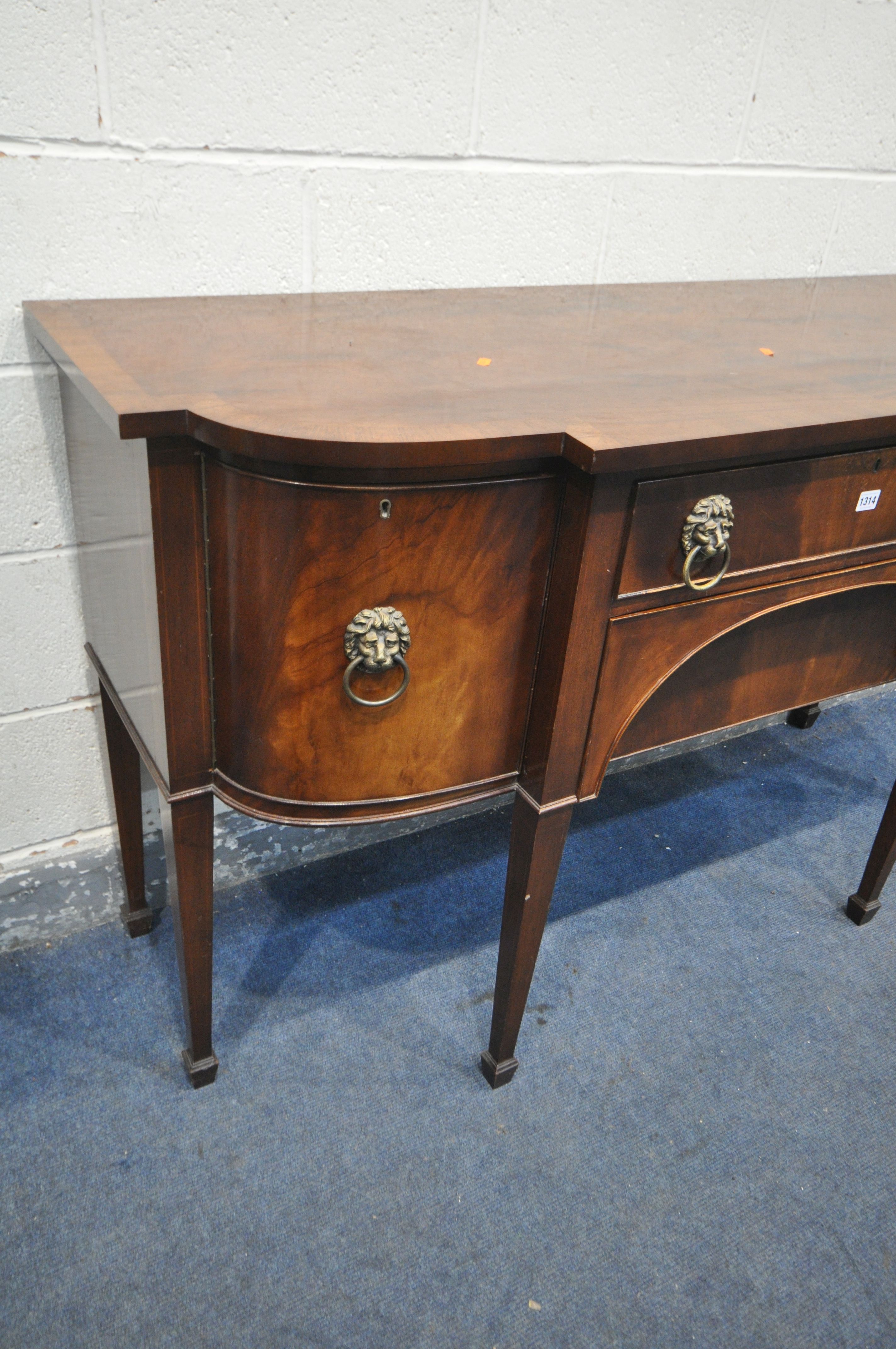 A GEORGIAN STYLE MAHOGANY SIDEBOARD, with double cupboard doors that's flanking two drawers, on - Image 2 of 3