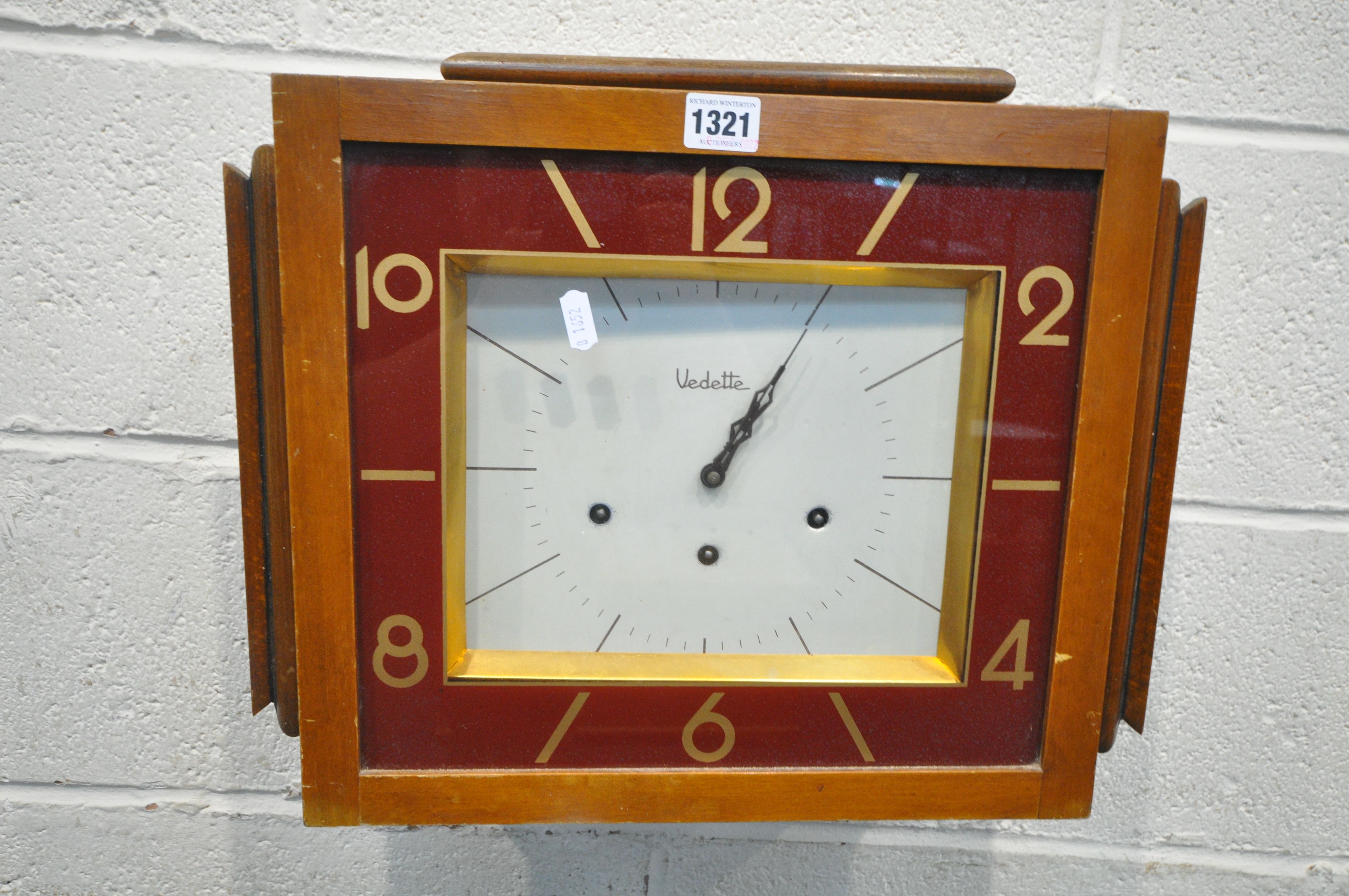 AN ART DECO WALNUT WALL CLOCK, labelled Vedette to the face, width 46cm x depth 17cm x height