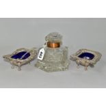 A PAIR OF SALTS WITH SILVER SPOONS AND A LARGE GLASS INKWELL, comprising two silver salt spoons by