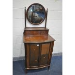 AN EDWARDIAN MAHOGANY BOW FRONT DRESSING CABINET, with a single circular bevelled mirror, two