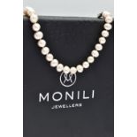 A CULTURED PEARL NECKLACE, a single strand of baroque cultured white pearls with a pink hue, forty
