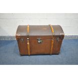 A VINTAGE CANVAS DOMED TRAVELING TRUNK, wooden banded, and leather corner patches, F.H.D. stamped to