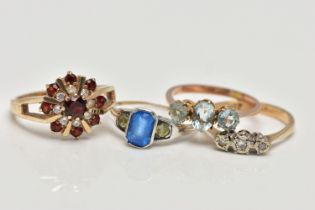 A SELECTION OF FOUR GEM SET RINGS, to include an early 20th century blue and colourless paste