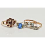 A SELECTION OF FOUR GEM SET RINGS, to include an early 20th century blue and colourless paste