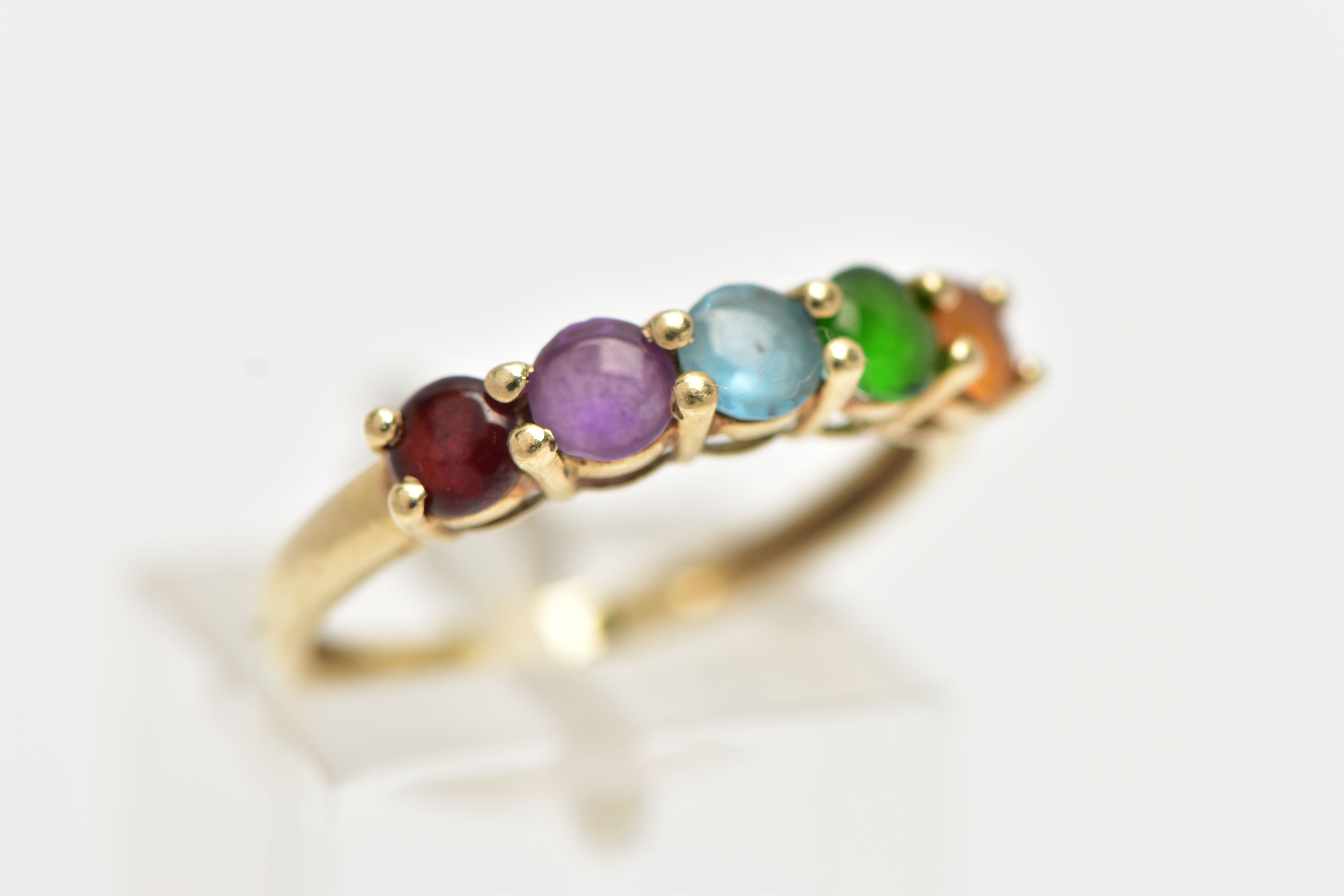 A 9CT GOLD FIVE STONE RING, designed with a row of five claw set, circular cut cabochon stones to - Image 4 of 4