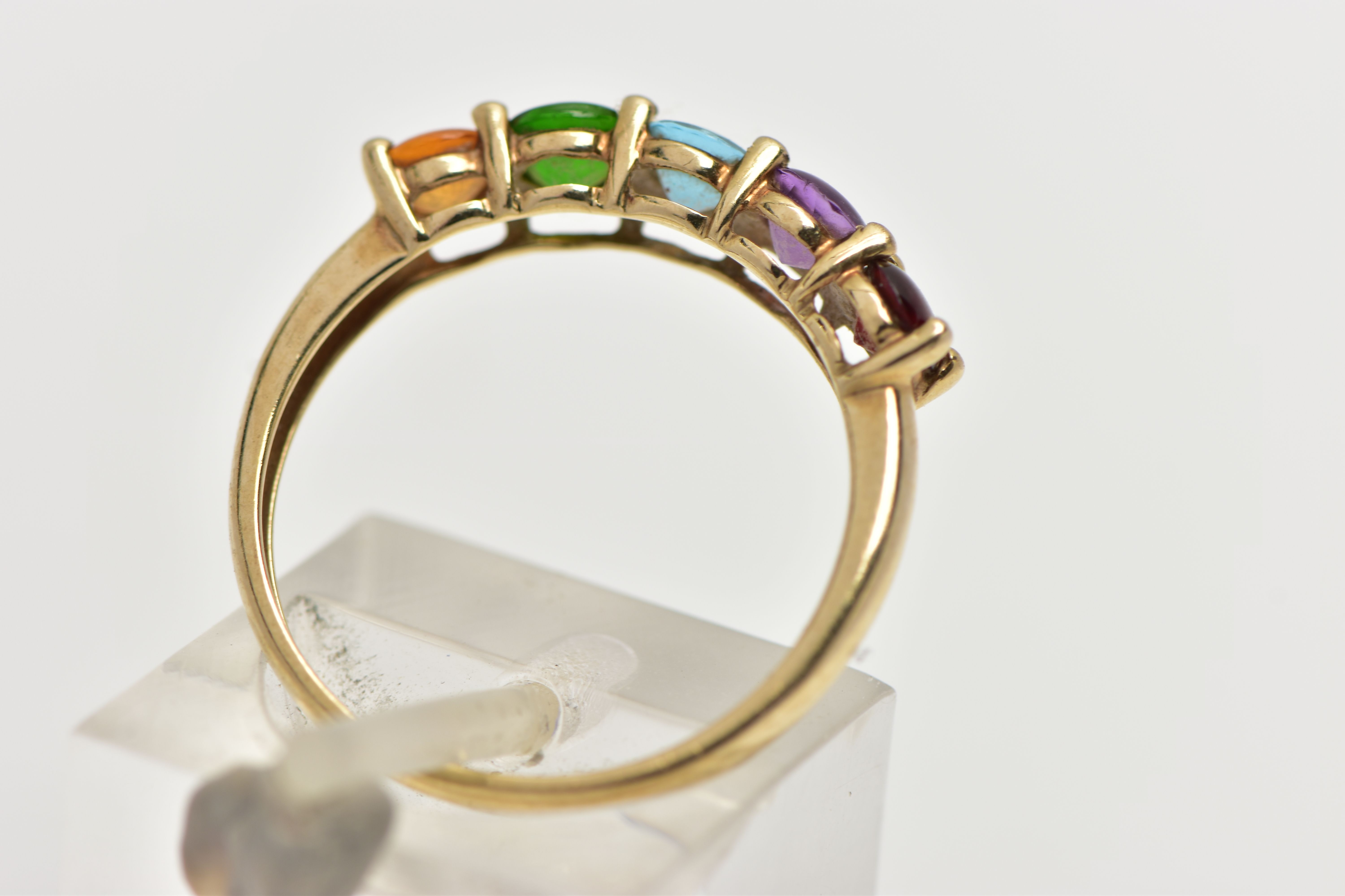 A 9CT GOLD FIVE STONE RING, designed with a row of five claw set, circular cut cabochon stones to - Image 3 of 4