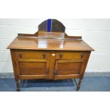 AN ART DECO OAK MIRRORBACK SIDEBOARD, with two drawers, width 120cm x depth 46cm x height 122cm (