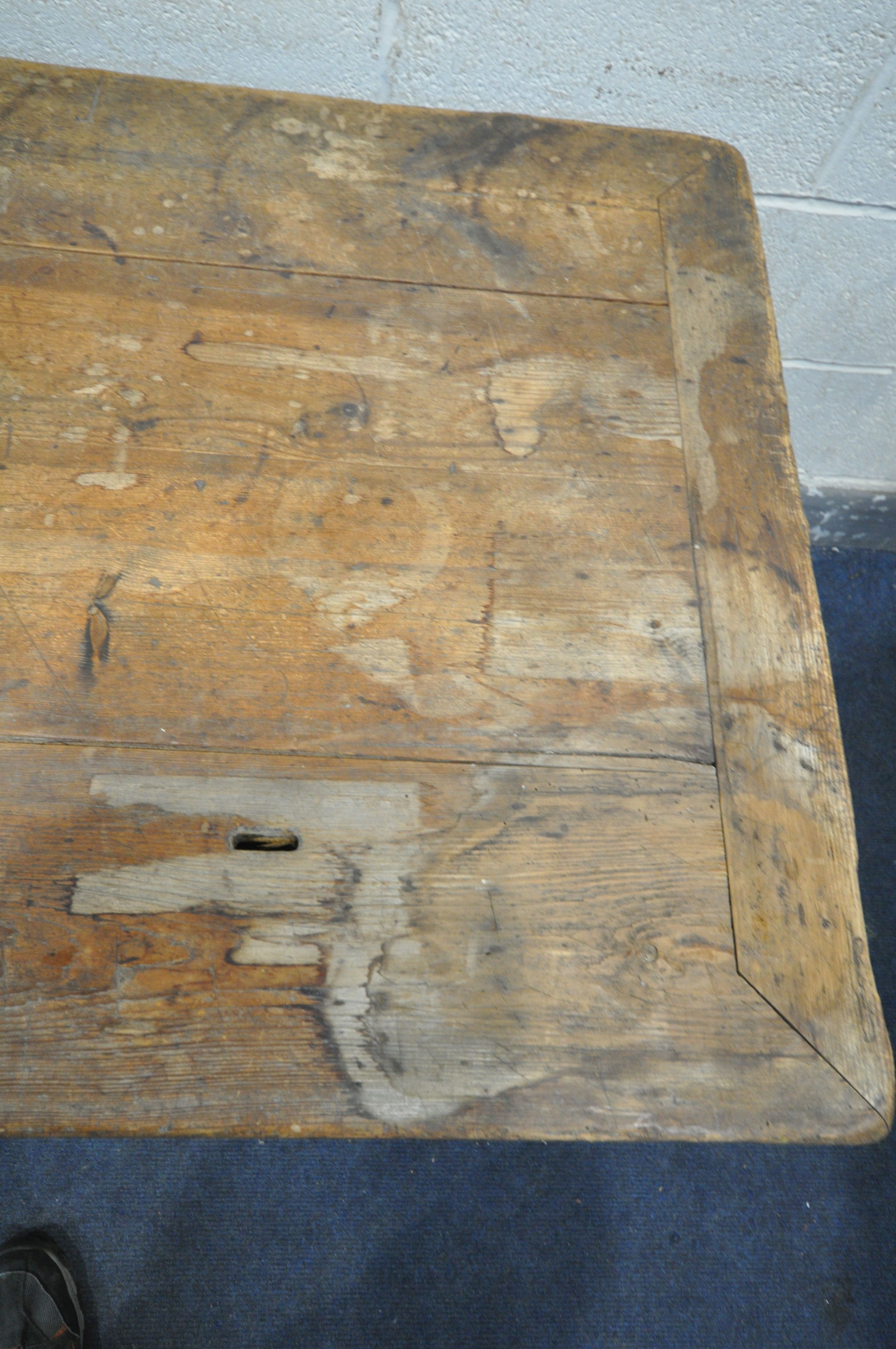 A 19TH CENTURY FARMHOUSE TABLE, the pine top with penny slots, three frieze drawers, on an oak base, - Image 2 of 6