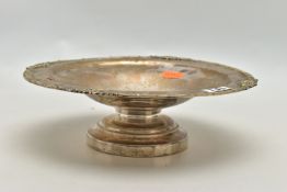 A SILVER RAISED DISH, of a circular form, floral detailed rim, personal engraving to the centre