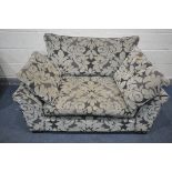 A FLORAL UPHOLSTERED LOVE SOFA, length 138cm (condition:-slightly discoloured)