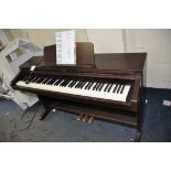 A TECHNICS SX-PX224/M DIGITAL PIANO with weighted keys in a mahogany effect cabinet (PAT pass and