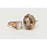 A 9CT GOLD SMOKY QUARTZ RING AND A QUARTZ RING, the first a large oval cut smoky quartz, set