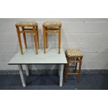 A PARTIALLY WHITE PAINTED DROP LEAF KITCHEN TABLE, with a single drawer, along with three stools (