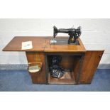 A VINTAGE SINGER WALNUT CASED ELECTRIC SEWING MACHINE (condition:-surface scratches, untested)