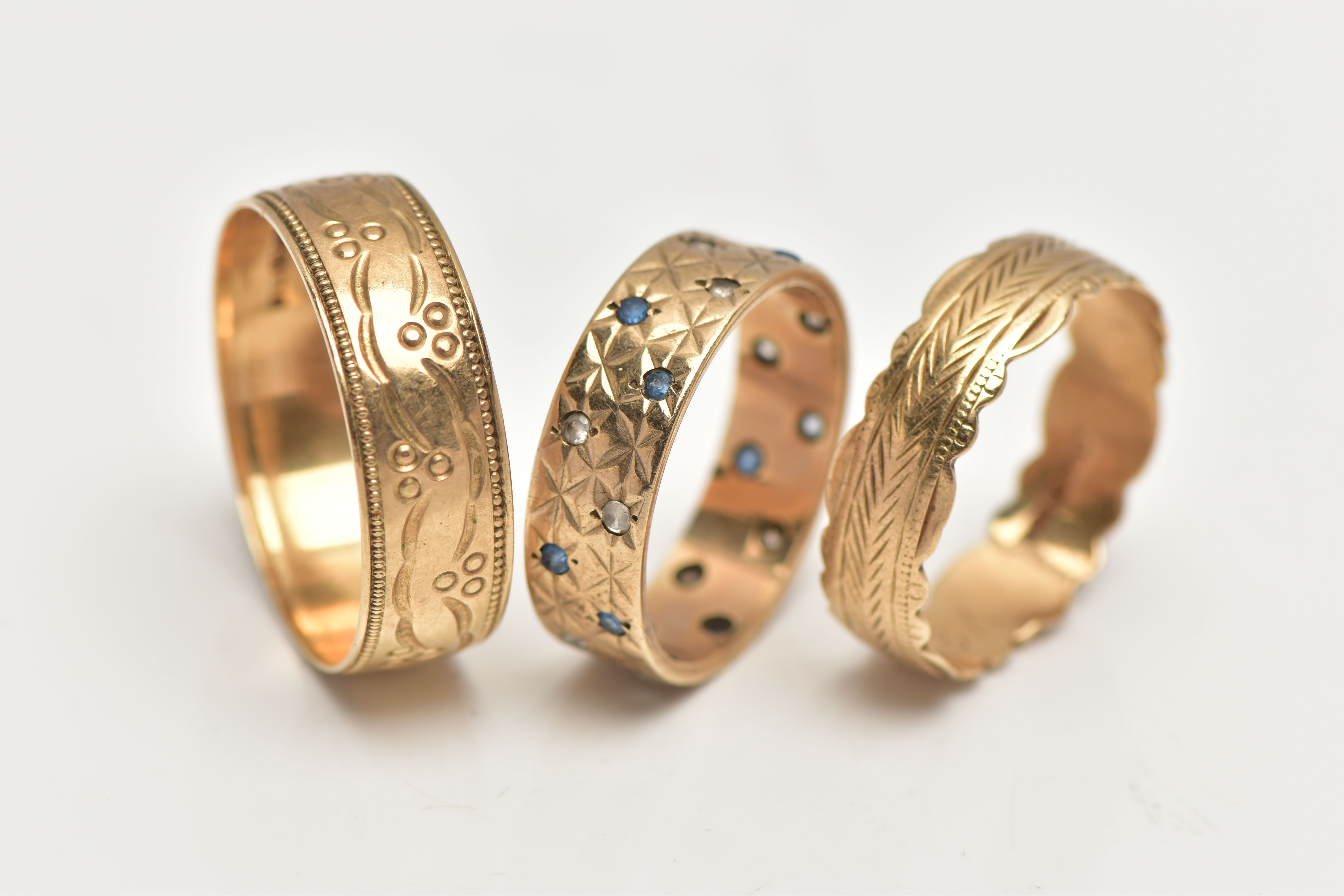 THREE 9CT GOLD BAND RINGS, the first a wide band set with small blue sapphires and spinels, with a - Image 3 of 3