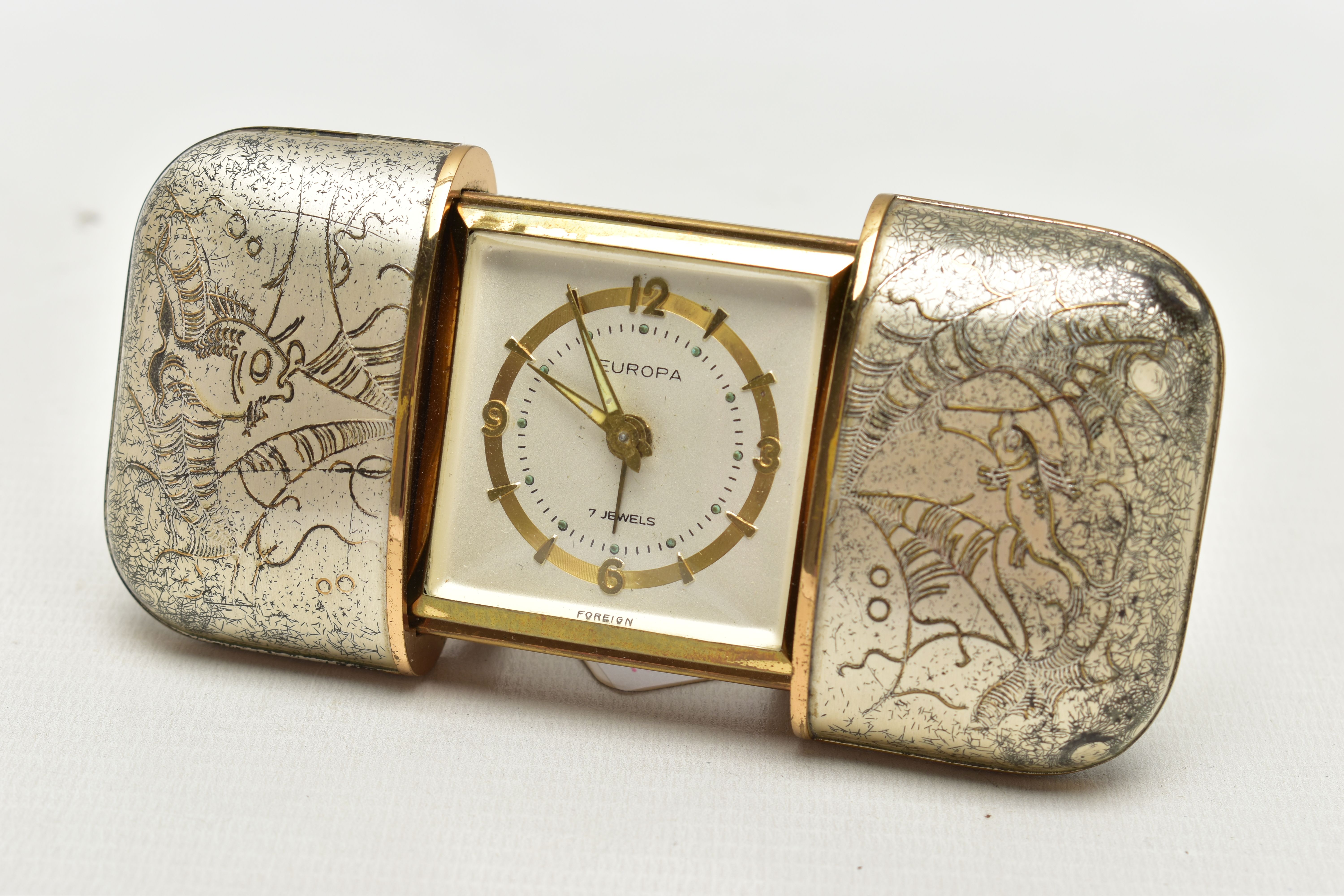 A 'EUROPA' TRAVEL CLOCK, early 20th century 'Europa' travel clock, a hand wound 7 jewelled