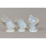 THREE SABINO OPALESCENT GLASS FISH, each on a circular base and marked Sabino, one having a