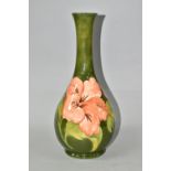 A LARGE MOORCROFT POTTERY CORAL HIBISCUS BOTTLE VASE, with tube lined coral hibiscus pattern on a