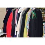 A COLLECTION OF OVER THIRTY ITEMS OF CLOTHING, to include men's and women's jackets, tops and