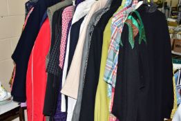 A COLLECTION OF OVER THIRTY ITEMS OF CLOTHING, to include men's and women's jackets, tops and