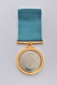 A CASED RAF MEDAL, circular medal engraved RAF motif to the front reads 'Squadron Royal Air Force