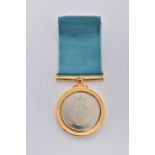 A CASED RAF MEDAL, circular medal engraved RAF motif to the front reads 'Squadron Royal Air Force